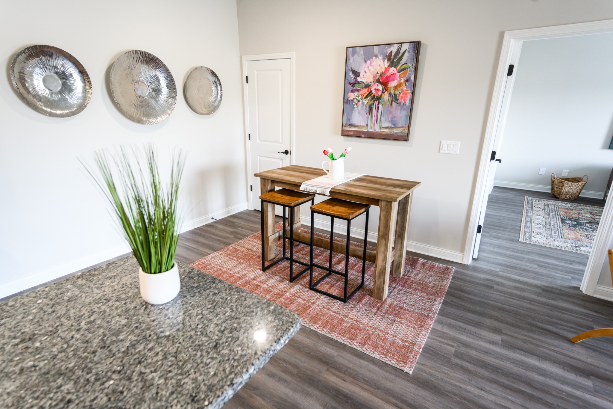 Dining area beside granite kitchen counter