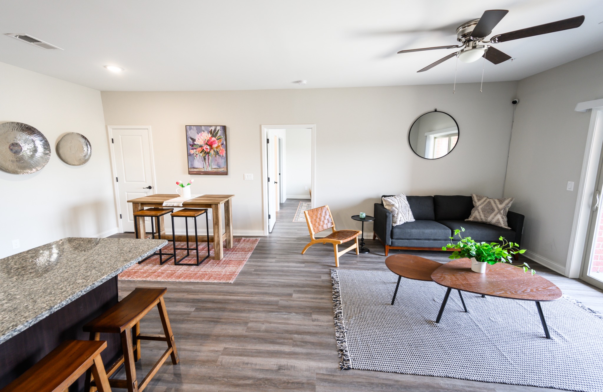Bright open-concept living room at Plum Ridge Apartments